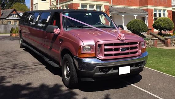 Hummer style American SUV with pink interior and 16 seats